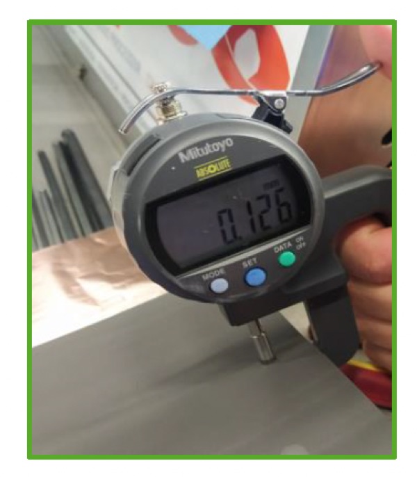Digital thickness gauge measuring dry electrode film in the lab